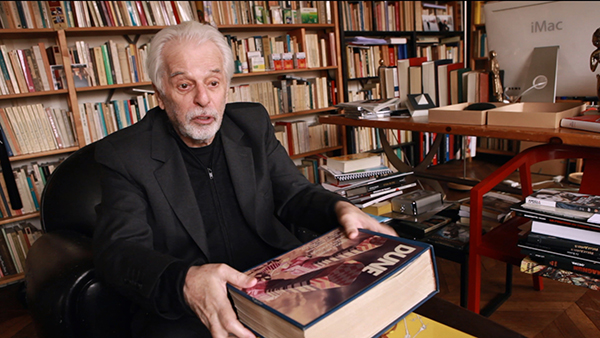 Alejandro Jodorowsky, seen here with the totemic book of storyboards for Dune