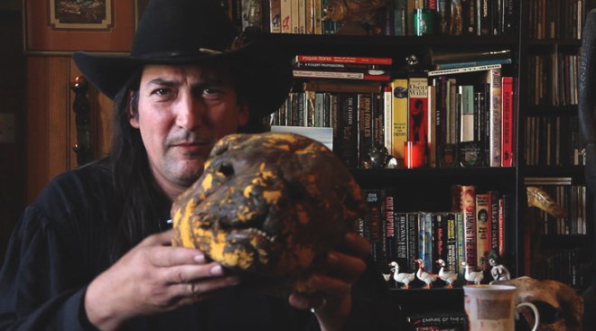 Richard Stanley, holding the Dog Man mask he used to sneak his way onto the set of The Island of Dr Moreau after he was fired